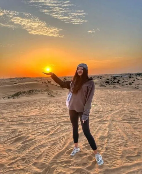 A women standing in desert
