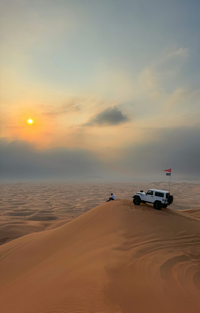 Dubai Desert Photos A Man with Jeep in Dubai Desert Photos