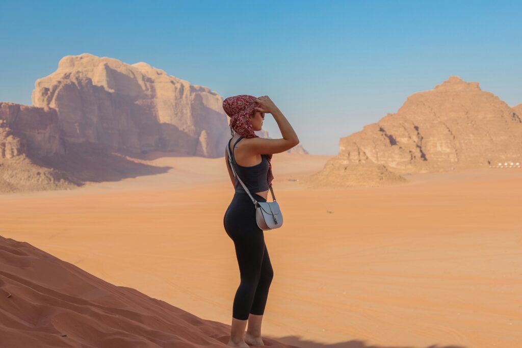A Girl Standing in Desert Lama Desert Safari Dubai