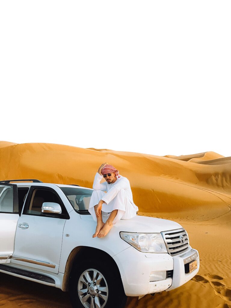 Experience the Ultimate Luxury Desert Safari in Dubai A Man Sitting on Front of Jeep Experience the Ultimate Luxury Desert Safari in Dubai
