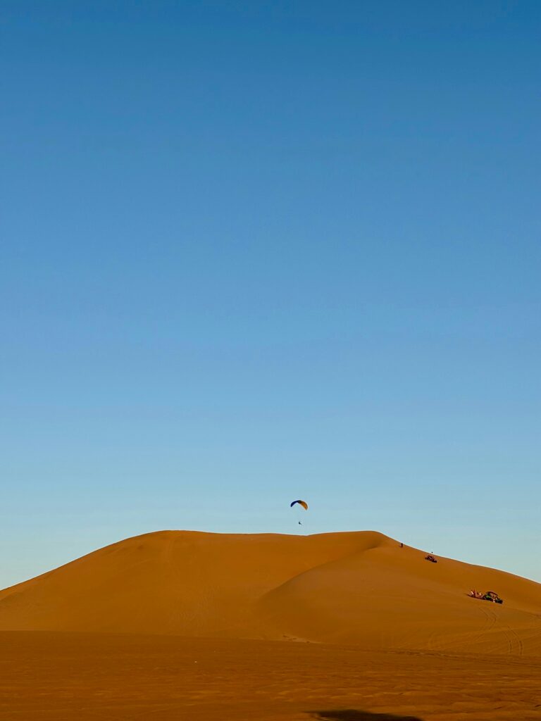 A Peraglider in Unique Desert Safari Camp in Dubai