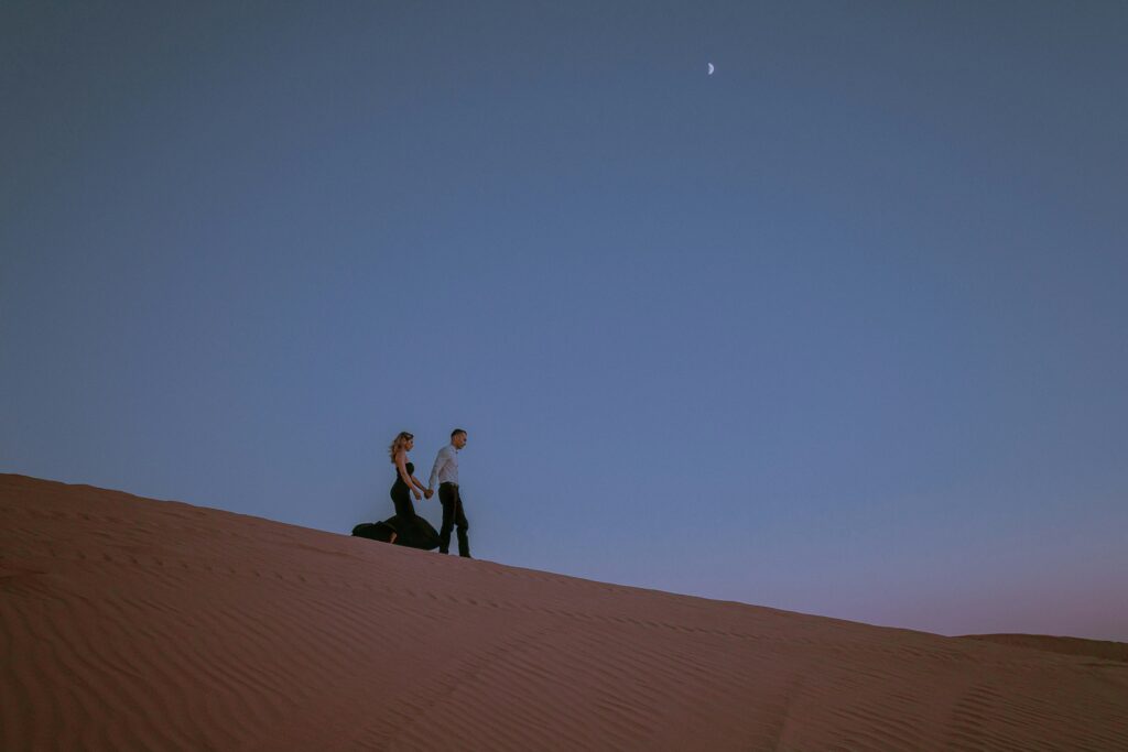 Stay in Desert Dubai A New Couple Walking on Sand Stay in Desert Dubai