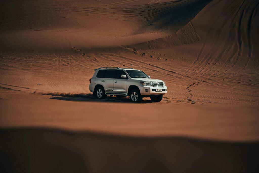 A White Land Cruiser in Platinum Heritage Desert Safari Dubai