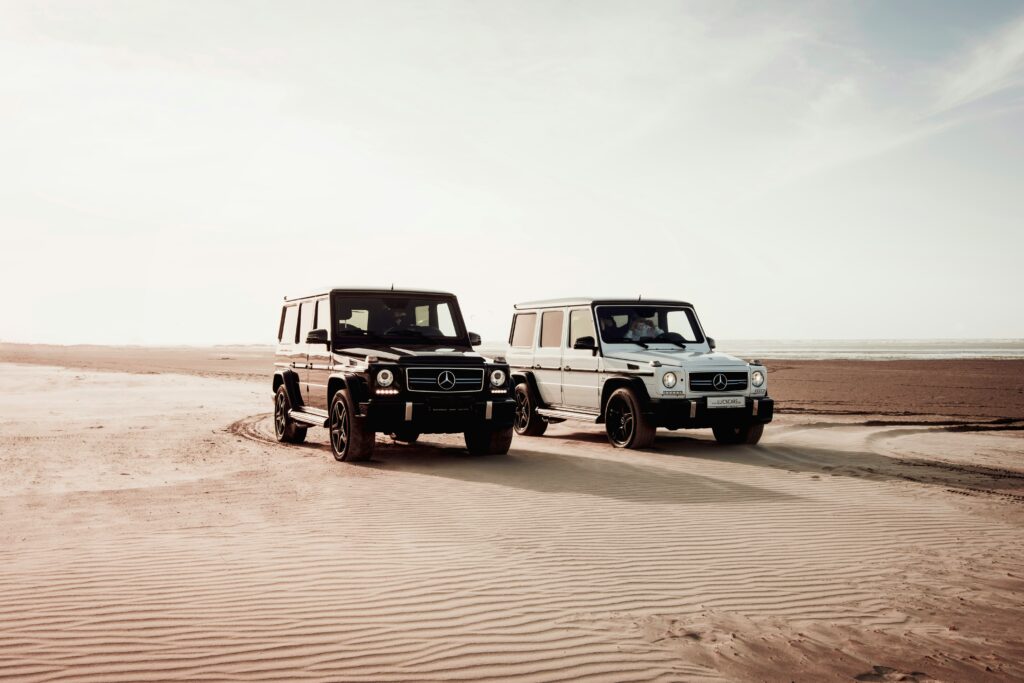Platinum Heritage Desert Safari Dubai Black and White Jeep in Desert Platinum Heritage Desert Safari Dubai