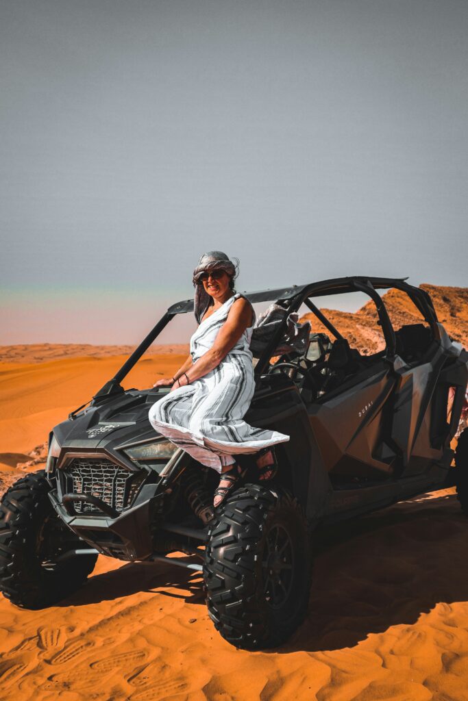 UAE Desert A Women Siting on Atv in UAE Desert