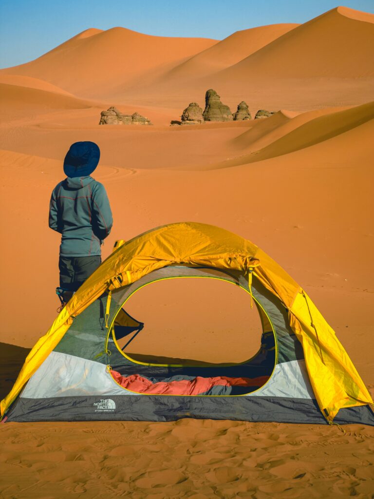 A Man With Yellow Camp in Unique Desert Safari Camp in Dubai