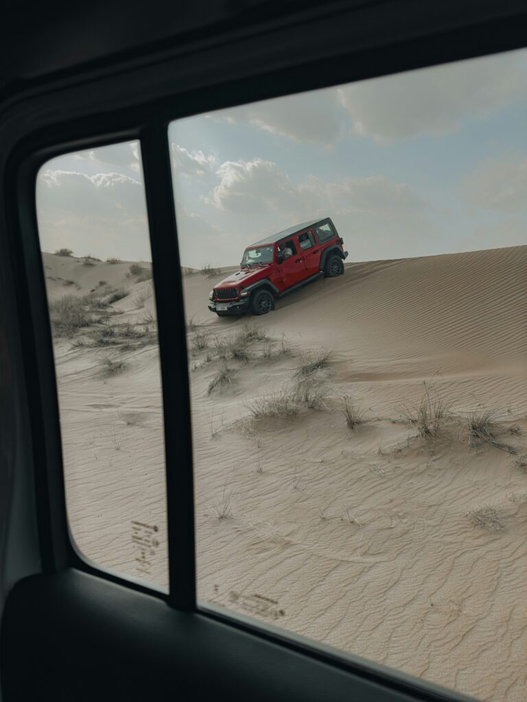 Red Jeep In UAE Desert