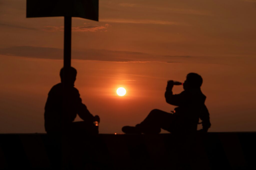 Sunrise Desert Safari Dubai Two Person Drinking Drink During Sunset in Sunrise Desert Safari Dubai