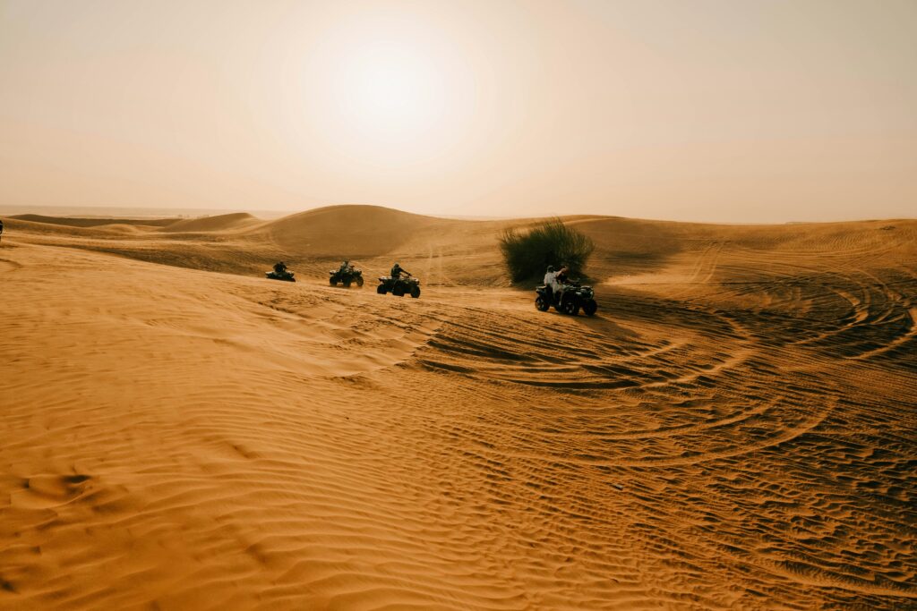 A Group of AtVs Racing in Desert Dune Buggy Abu Dhabi