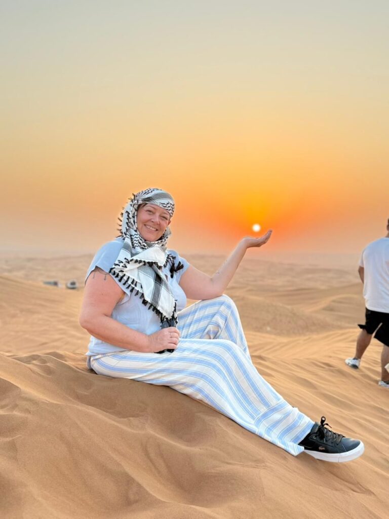 A women sitting in desert