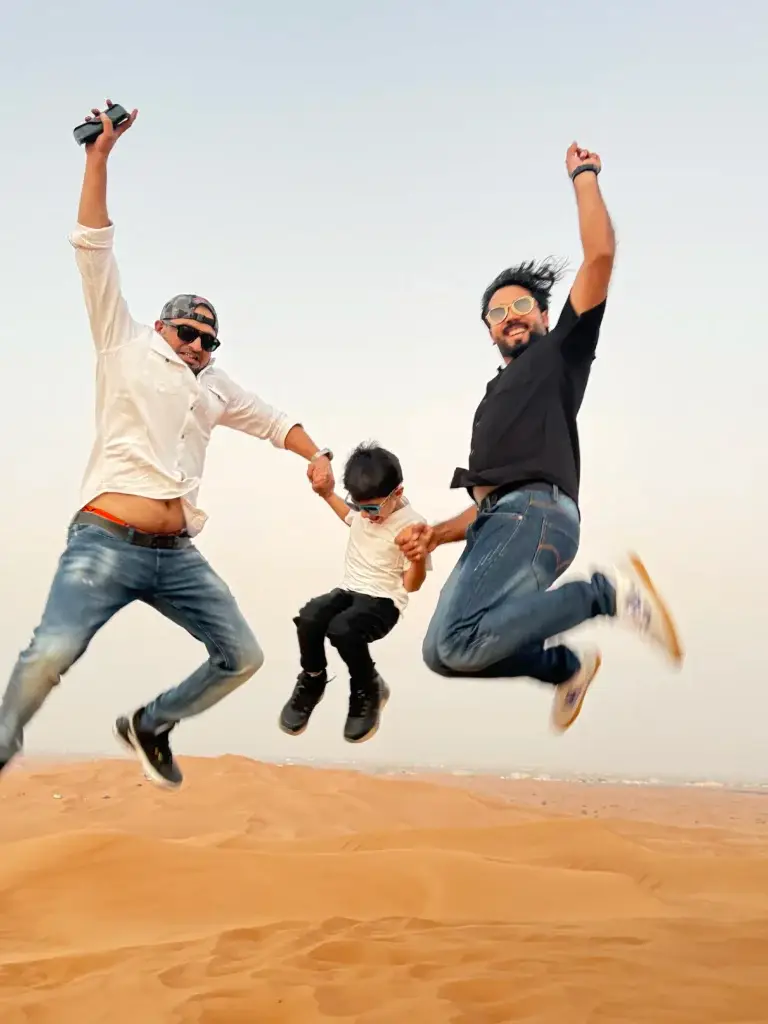 3 man jumping in desert